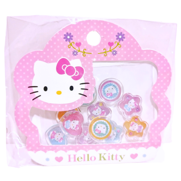 Front view of vintage Sanrio Hello Kitty acrylic decoration sticker pack in its original packaging, featuring various glittery acrylic stickers on a pink and white polka-dot floral-shaped card.